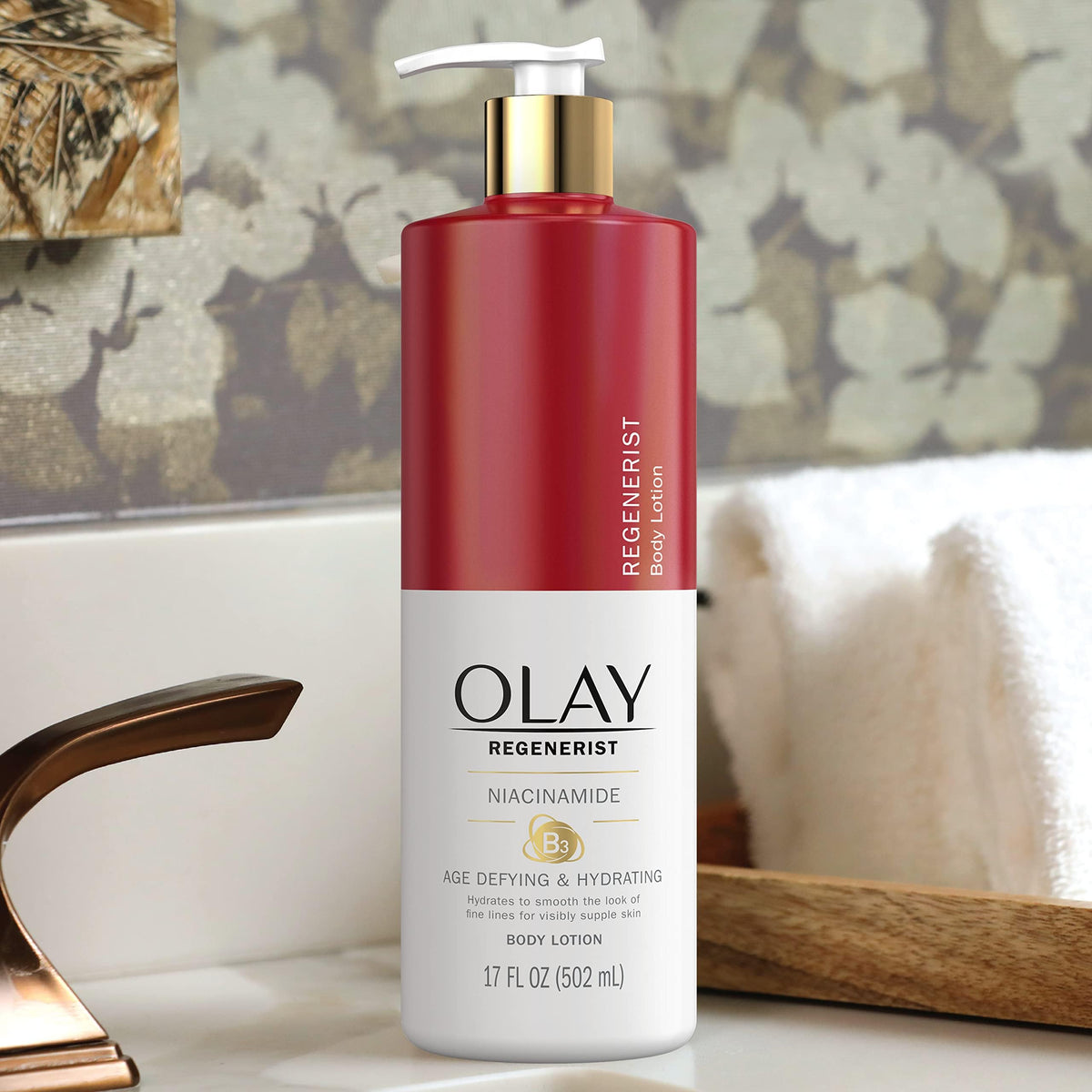 Pack of four Olay age-defying body lotions Niacinamide shown together.