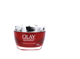 Hands applying OLAY Regenerist cream to the face for wrinkle smoothing.