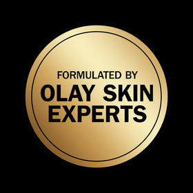 Olay smoothing lotion pump close-up showcasing Retinol and Vitamin B3 ingredients.