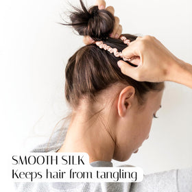 OLESILK skinny silk scrunchie wrapped around a ponytail for secure hold.