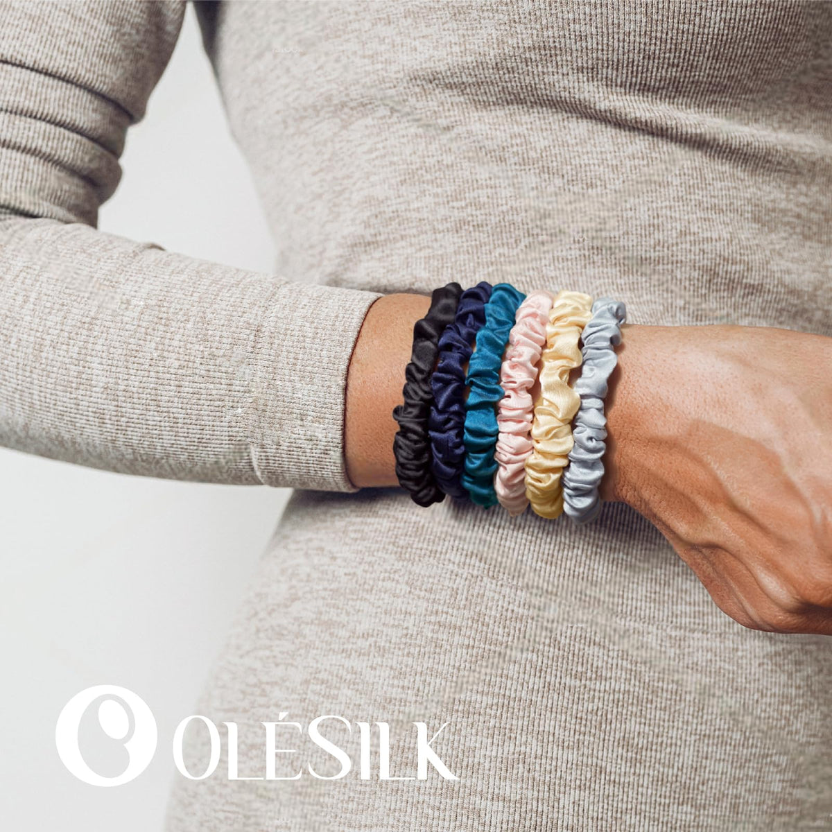 OLESILK hair tie worn on wrist as a stylish bracelet.