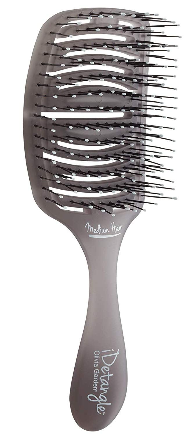 Olivia Garden iDetangle brush close-up with vented head for gentle detangling.