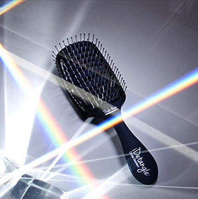 Professional-grade Olivia Garden iDetangle brush reflecting salon-quality design