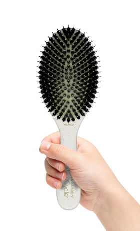 Olivia Garden NewCycle round brush with ionic bristles for smoother, frizz-free styling.