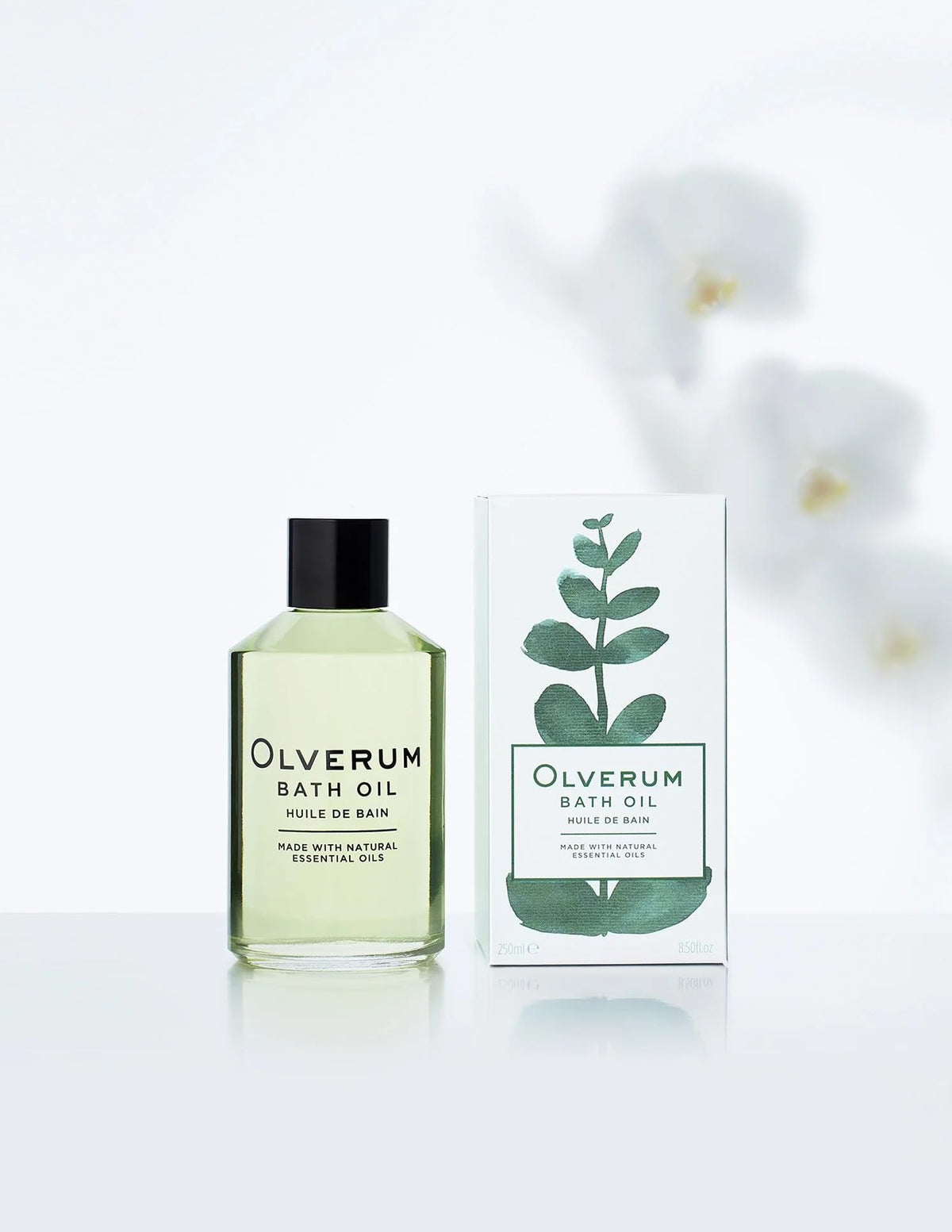 Close-up of OLVERUM bath oil’s amber liquid signaling rich skin nourishment.