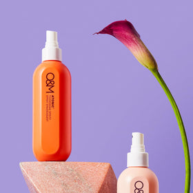 O&M Atonic texture spray hair application shows added body during styling.