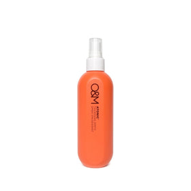 O&M Atonic thickening spray bottle boosts volume for fuller hair.