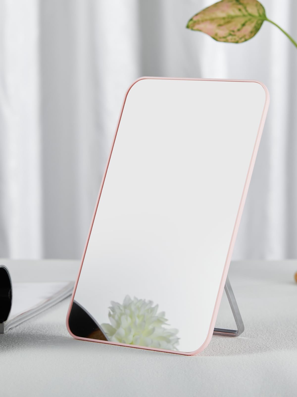 OMIRO compact 8x5 inch mirror is a lightweight travel companion for on-the-go grooming
