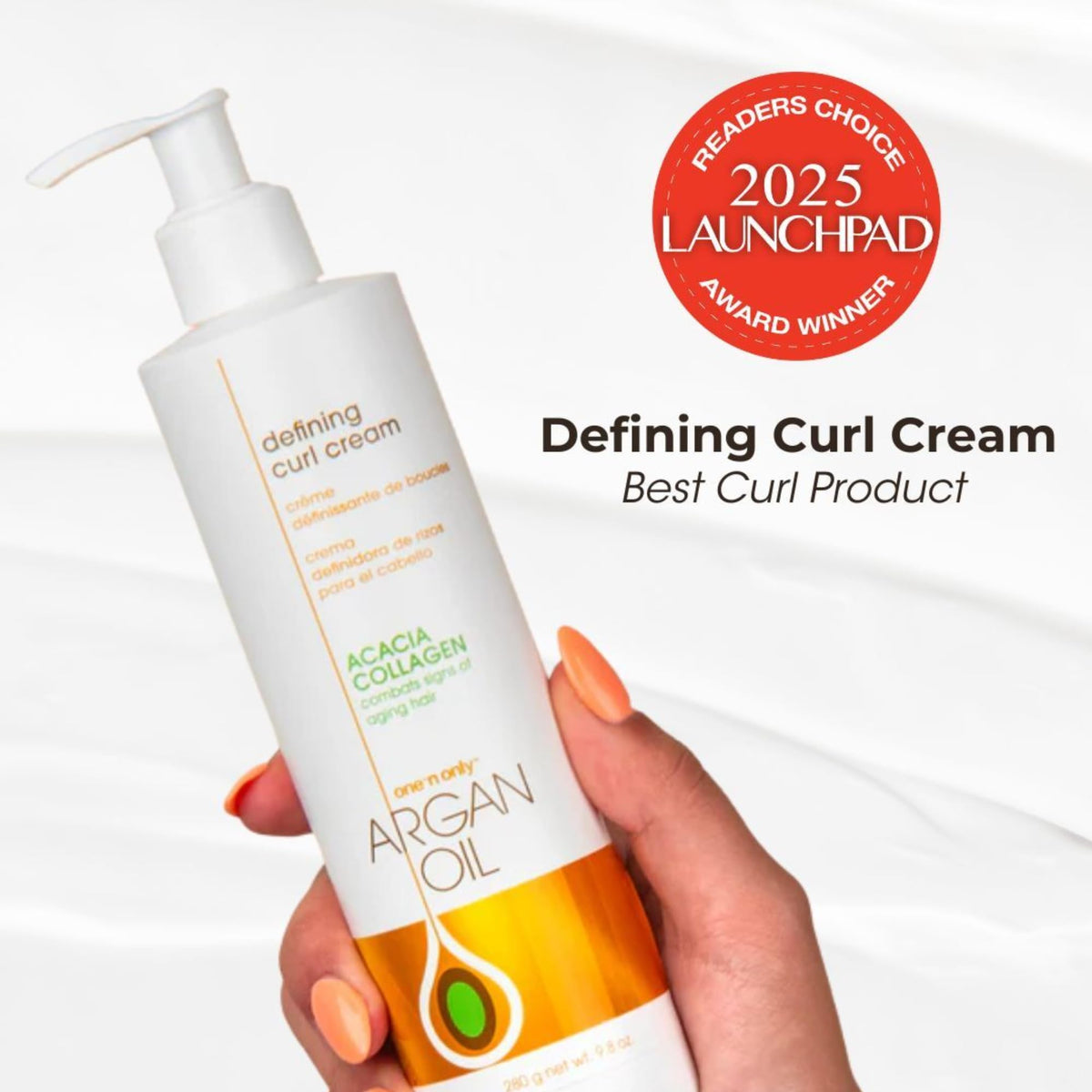 Hair being treated with One 'n Only Defining Curl Cream and Argan Oil.
