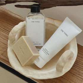 Compact tub of ONE THING Centella Soothing Cream for travel