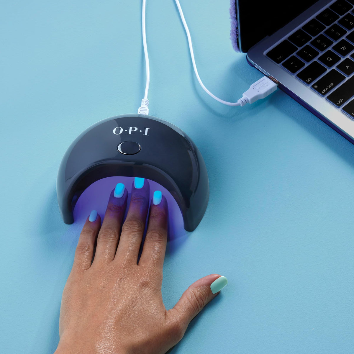 OPI GELement LED lamp at home manicure in a comfortable setting.