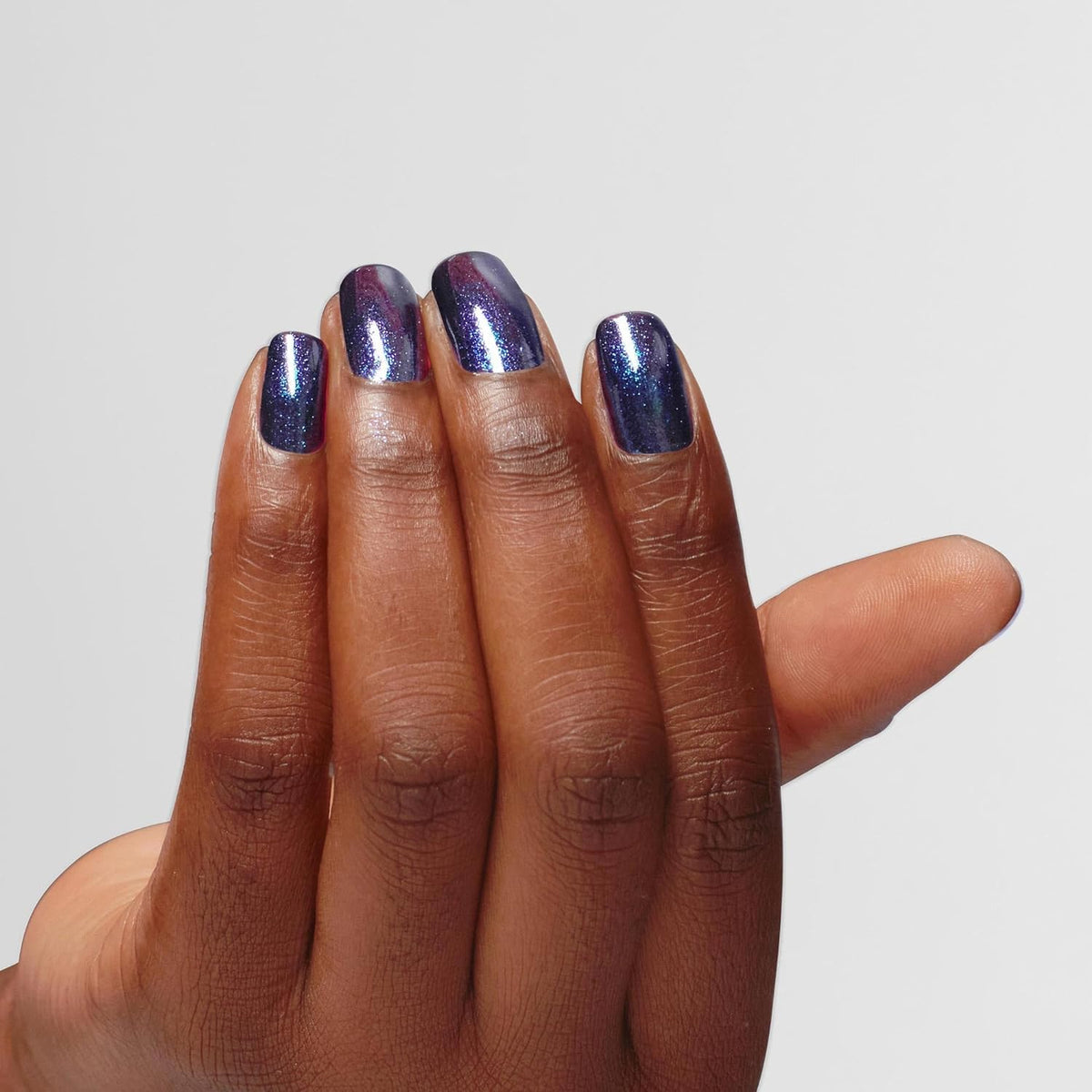 OPI Infinite Shine Awe Night Long swatch reveals sheer navy shimmer depth