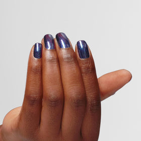 OPI Infinite Shine Awe Night Long swatch reveals sheer navy shimmer depth