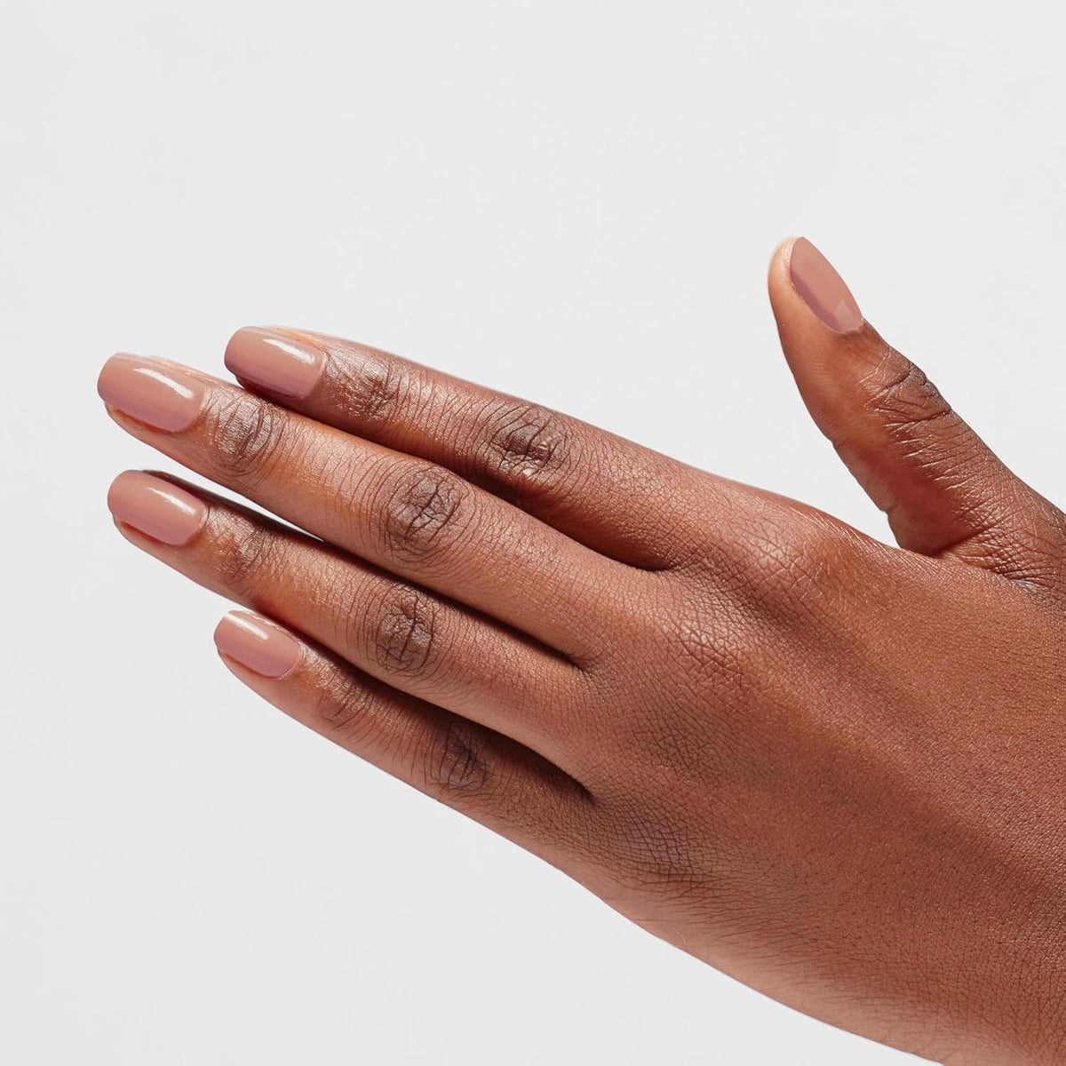 OPI Infinite Shine Barefoot in Barcelona top coat highlights a high-shine finish.