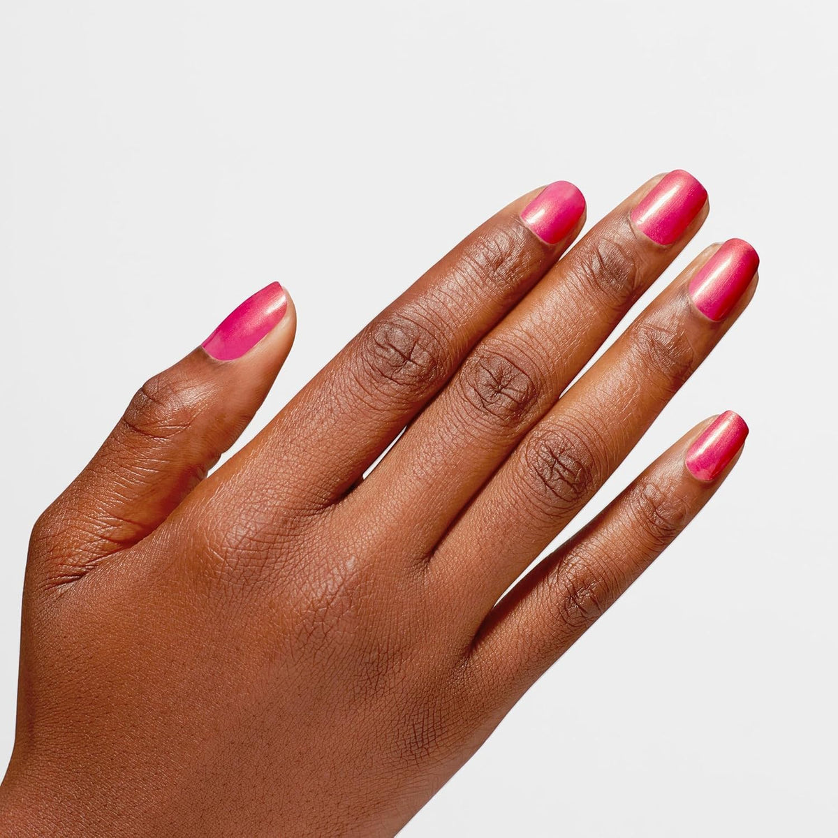OPI Infinite Shine Good Redputation swatch reveals opaque red pearl with a glossy finish.