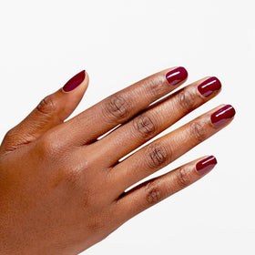 OPI Infinite Shine Malaga Wine bottle cap close-up showing rich color.