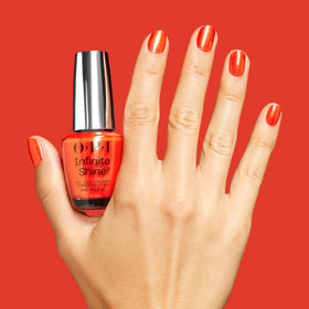 OPI Shock Em Orange manicure close-up highlighting sparkling shimmer