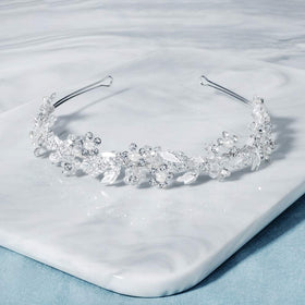 Oriamour silver headpiece for brides pairs with veils and gowns for elegant ceremony look.