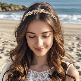 Oriamour headband catches light under aisle and reception lighting.