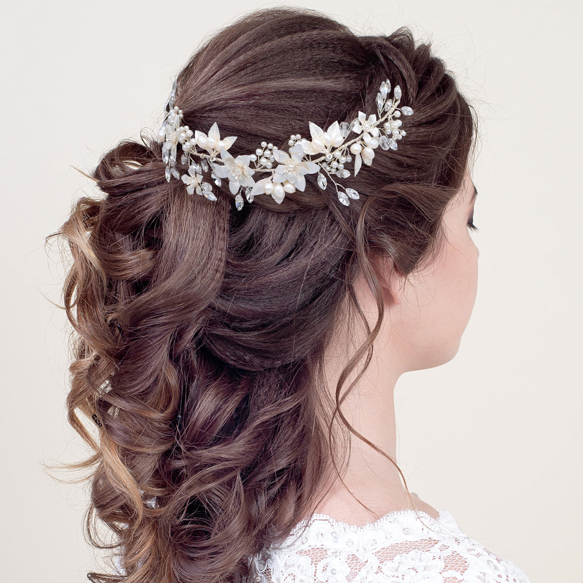 Oriamour silver headpiece with soft pink hues and gold accents.