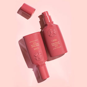 ORIBE Bright Blonde serum in hand demonstrating quick application before styling