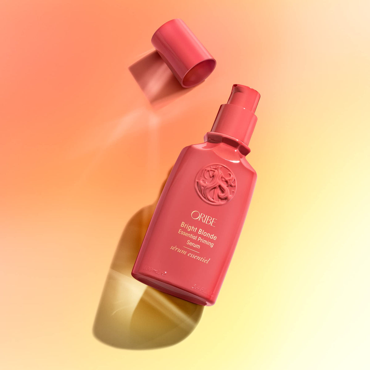 Damp hair with ORIBE serum indicating moisture replenishment and softness
