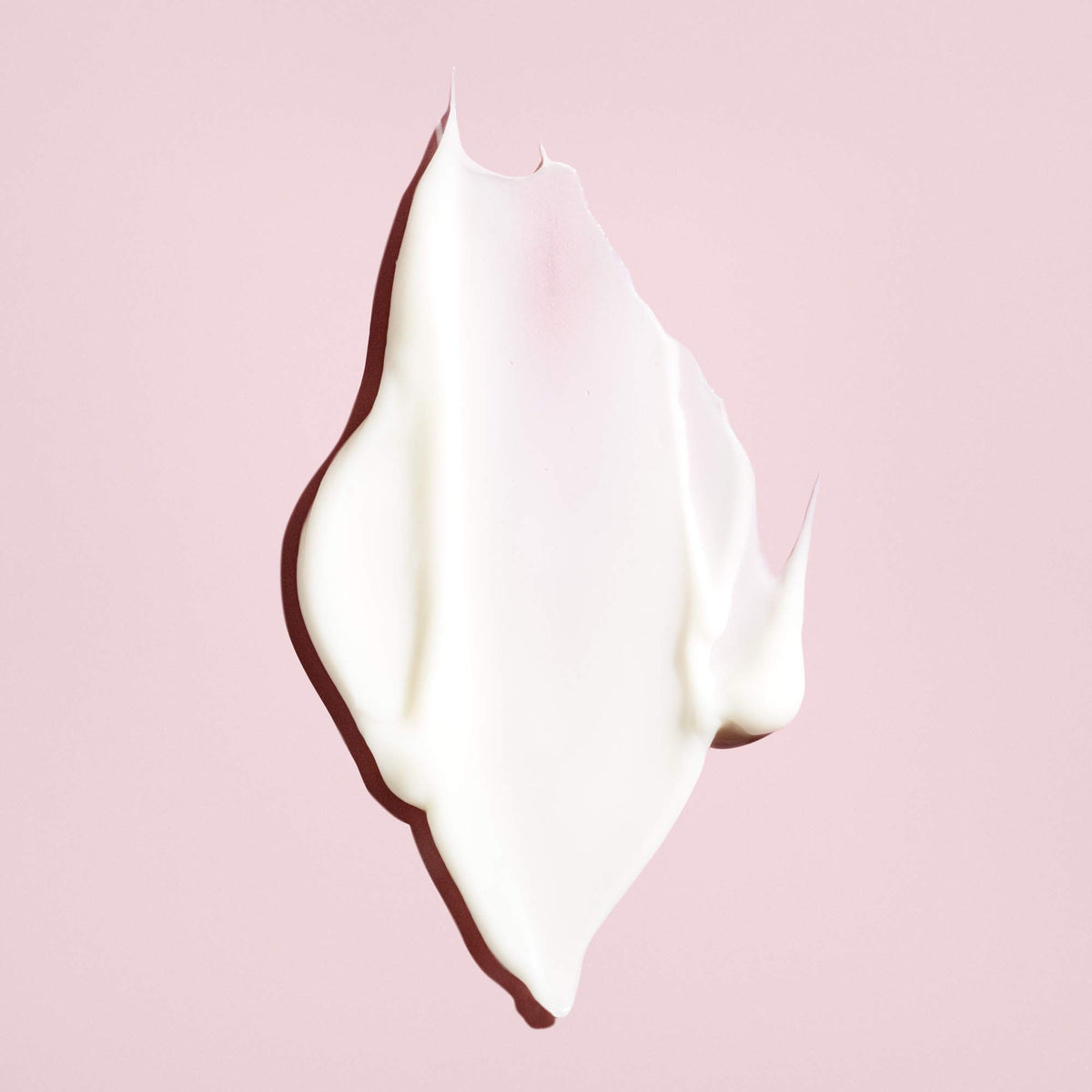 Oribe conditioner cream texture closeup showing rich, moisturizing formula