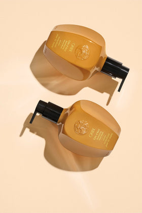Oribe Côte d’Azur hand wash close-up showing rich lather and soft hands.