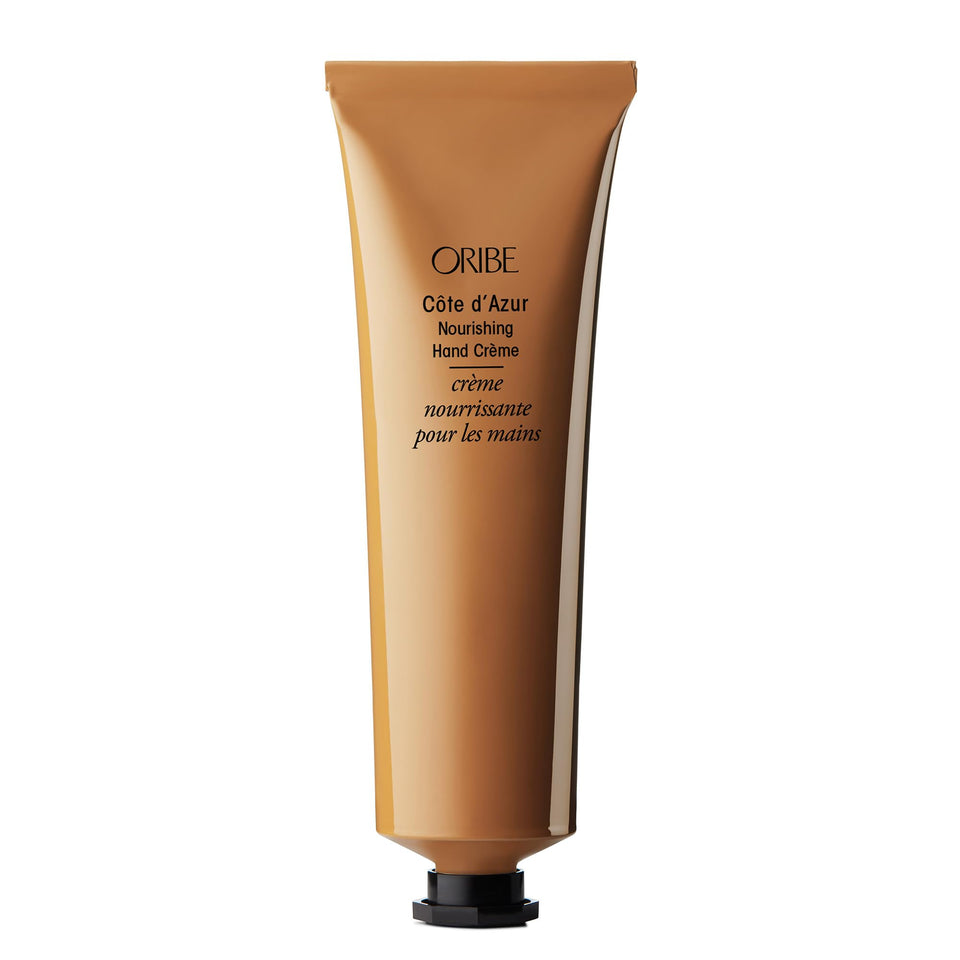 Oribe Côte d’Azur Nourishing Hand Crème bottle close-up showing luxurious texture and hydration potential.