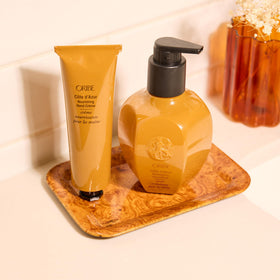 Oribe Côte d’Azur Nourishing Hand Crème fragrance close-up conveys signature scent.