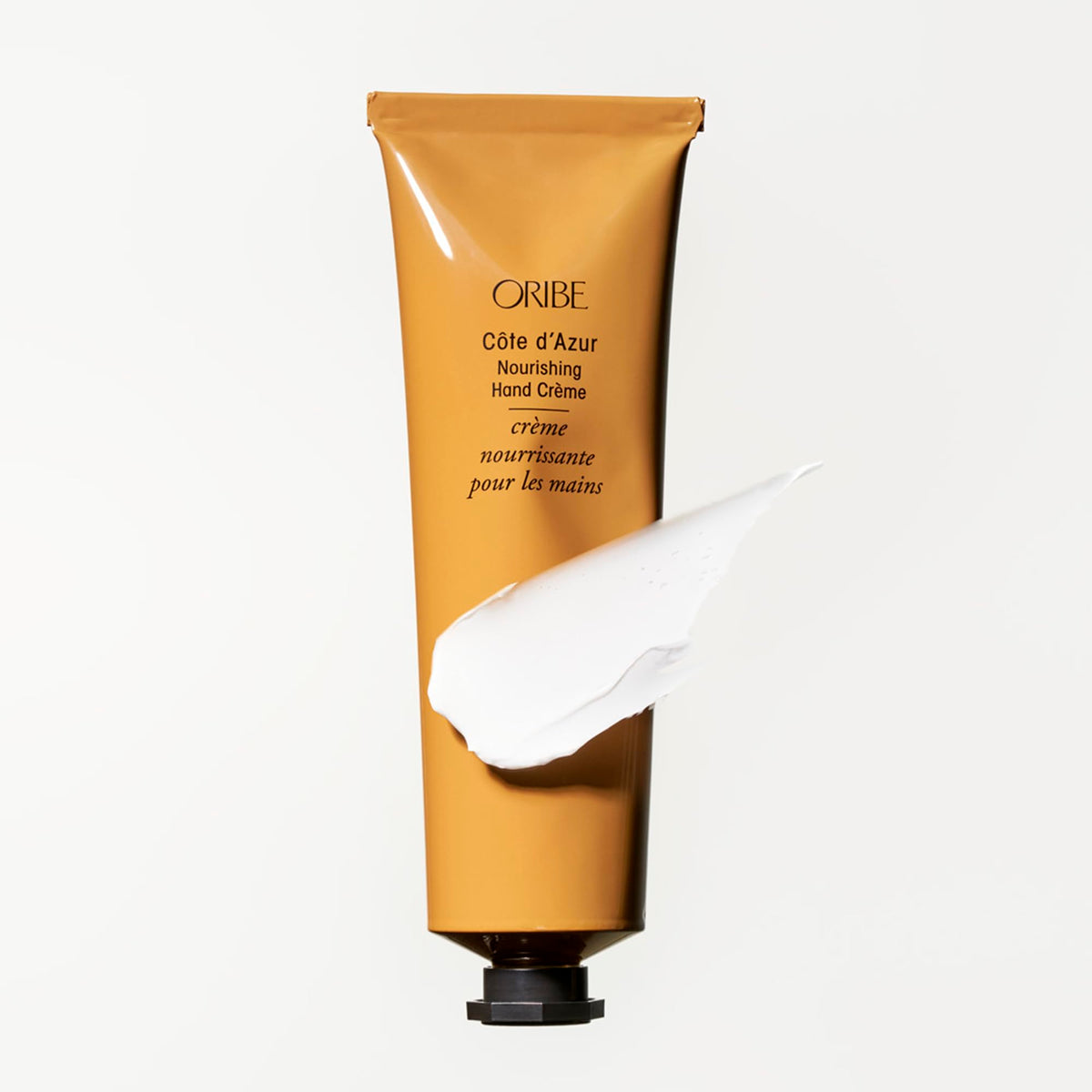 Oribe Côte d’Azur Nourishing Hand Crème on velvety skin implies smooth, soft hands.