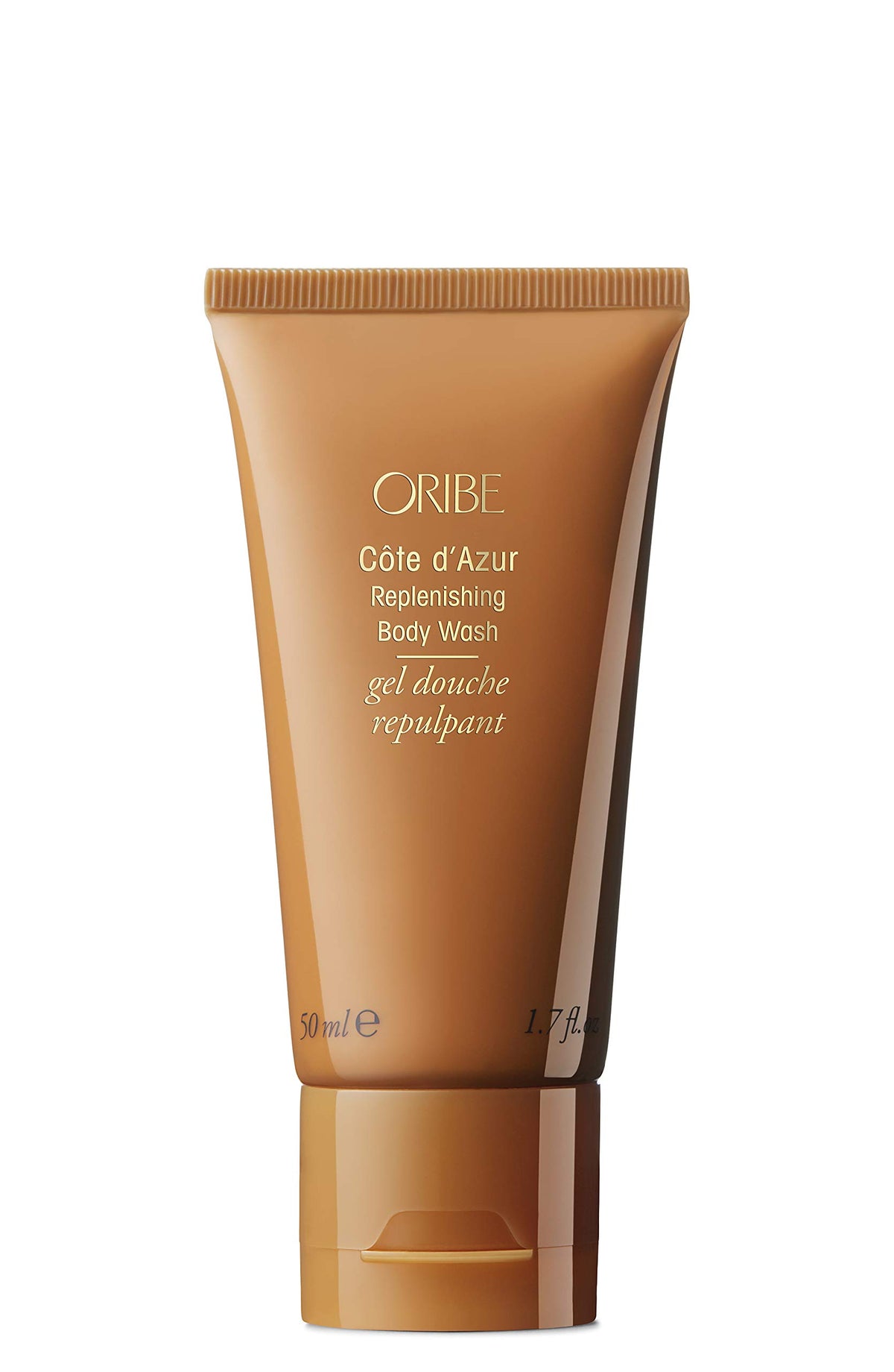 Oribe Côte d’Azur replenishing body wash bottle pouring for silky skin.