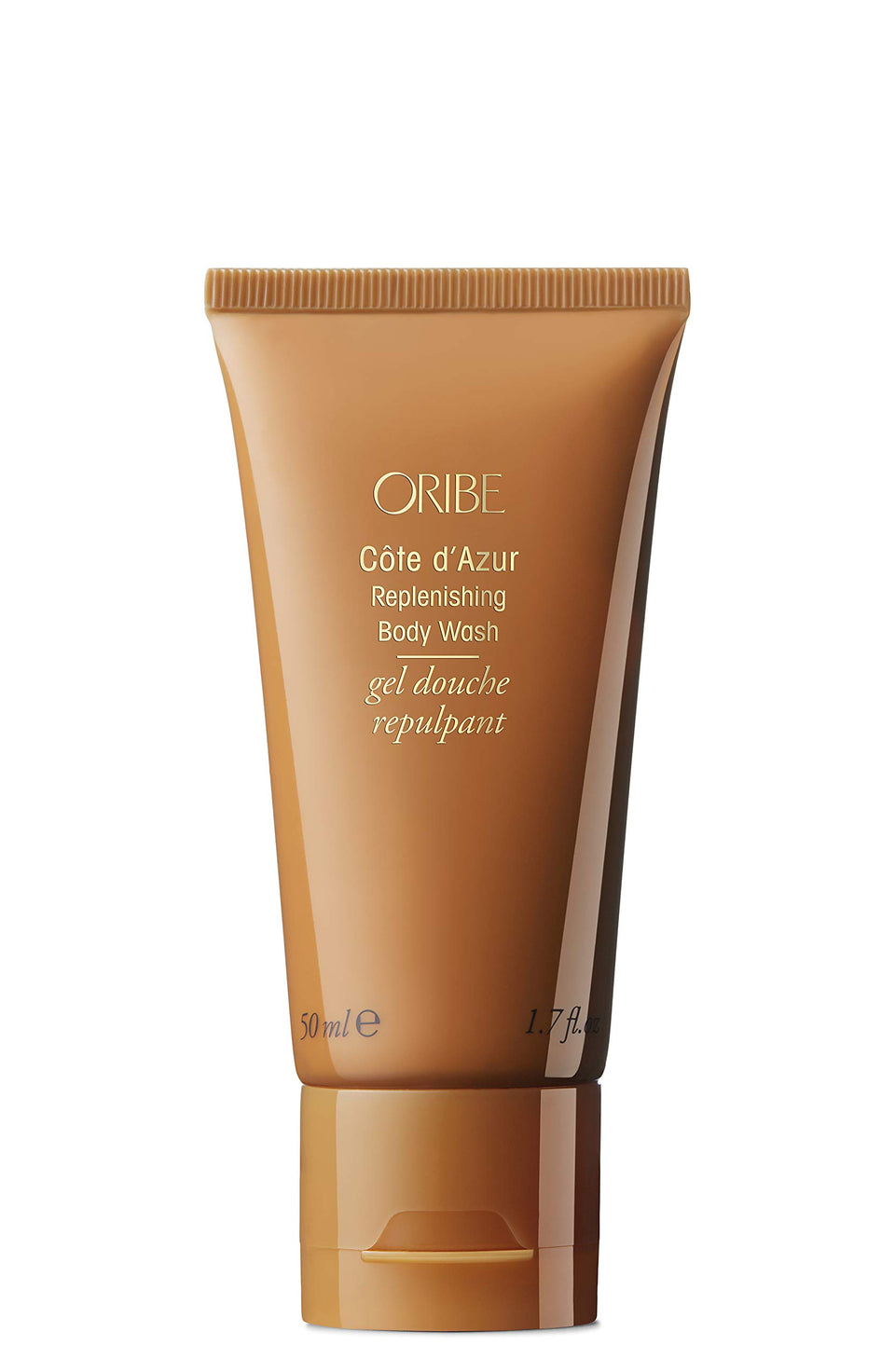 Oribe Côte d’Azur replenishing body wash bottle pouring for silky skin.