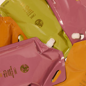 Oribe Côte d’Azur travel refill demonstrates eco-friendly care on the go.