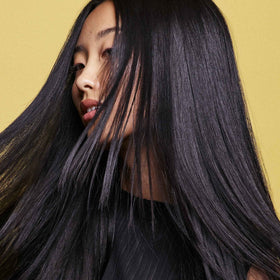 Oribe Hair Alchemy Resilience Shampoo floral blend daisy honeysuckle fortifies ends.