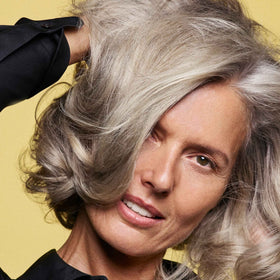 Oribe Hair Alchemy Resilience Shampoo plant-based protein close-up reinforces strands.