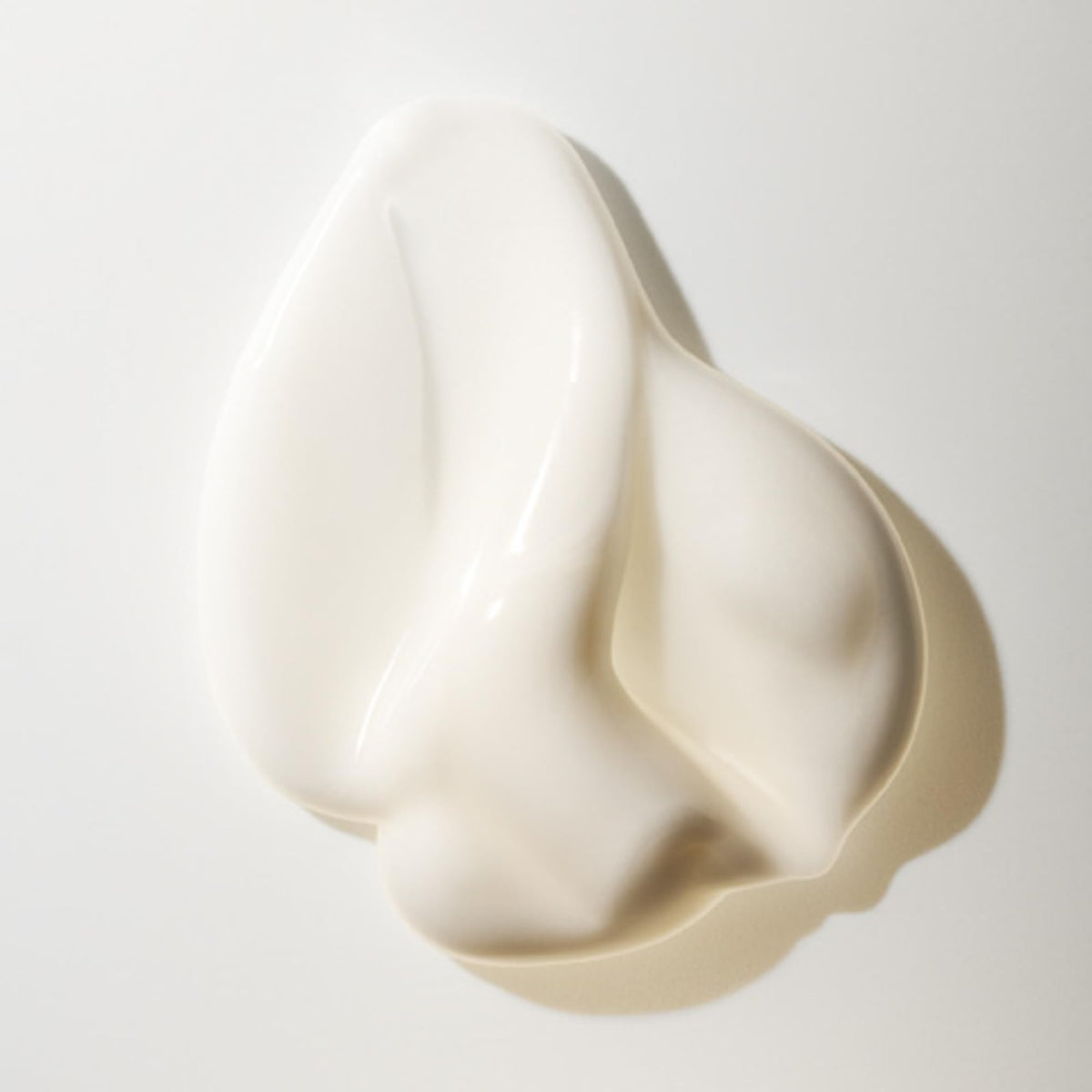 Oribe Hair Alchemy Strengthening Masque application scene suggests easy, indulgent conditioning routine.