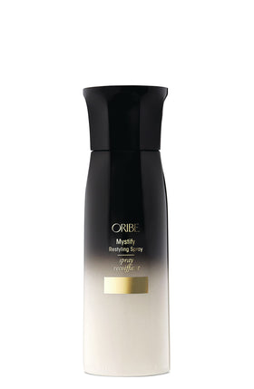 Oribe Mystify Restyling Spray bottle shows lightweight hold and heat protection for restyling