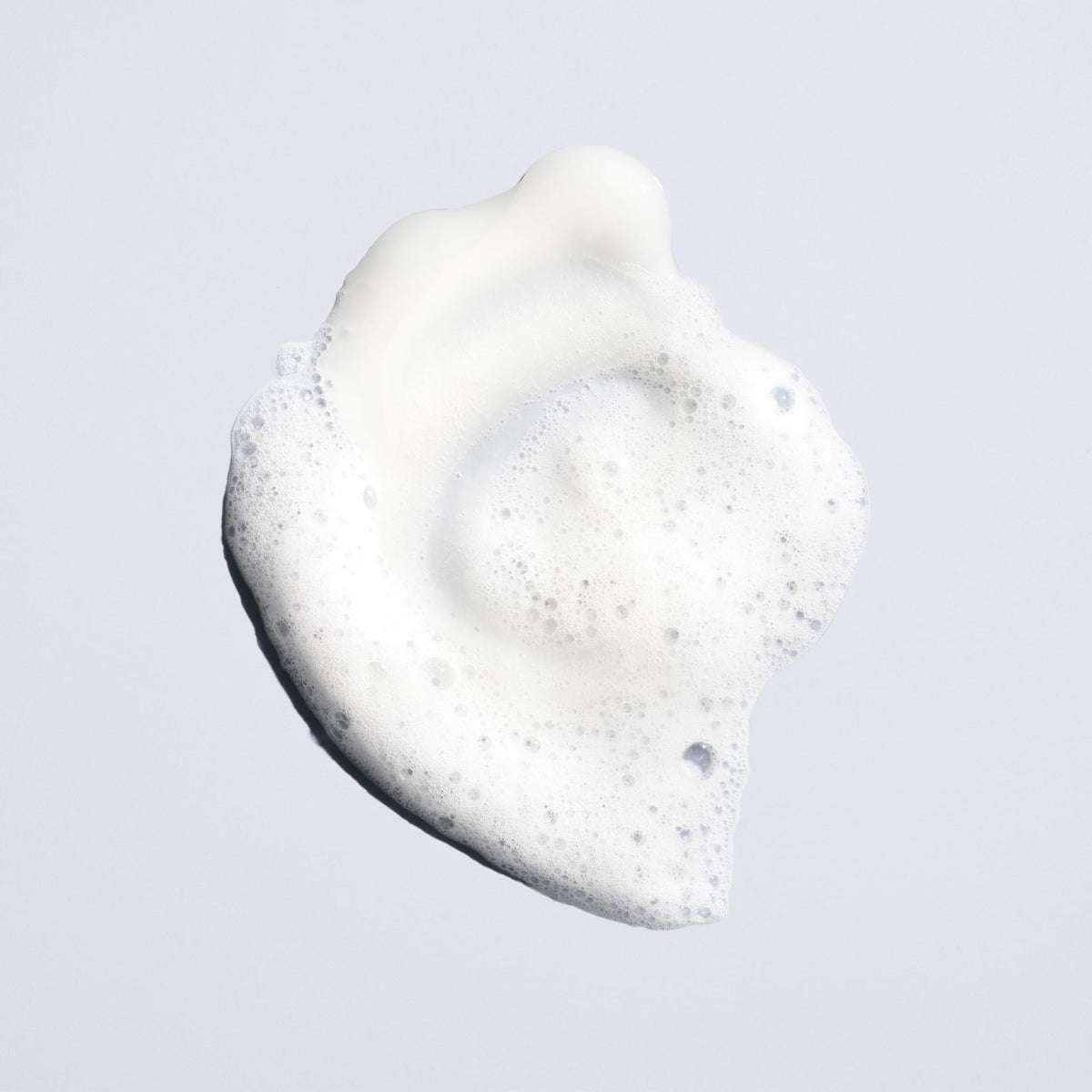 Oribe Run-Through Detangling Shampoo bottle with clear label and clean design
