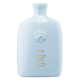 Oribe Run-Through Detangling Shampoo bottle pour showing slip for easy detangling