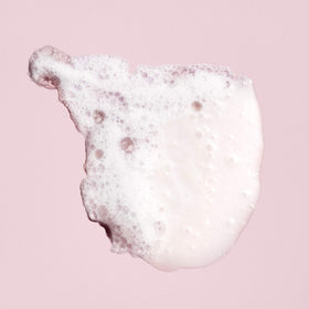 Closeup of Oribe shampoo foamy lather for luxurious wash