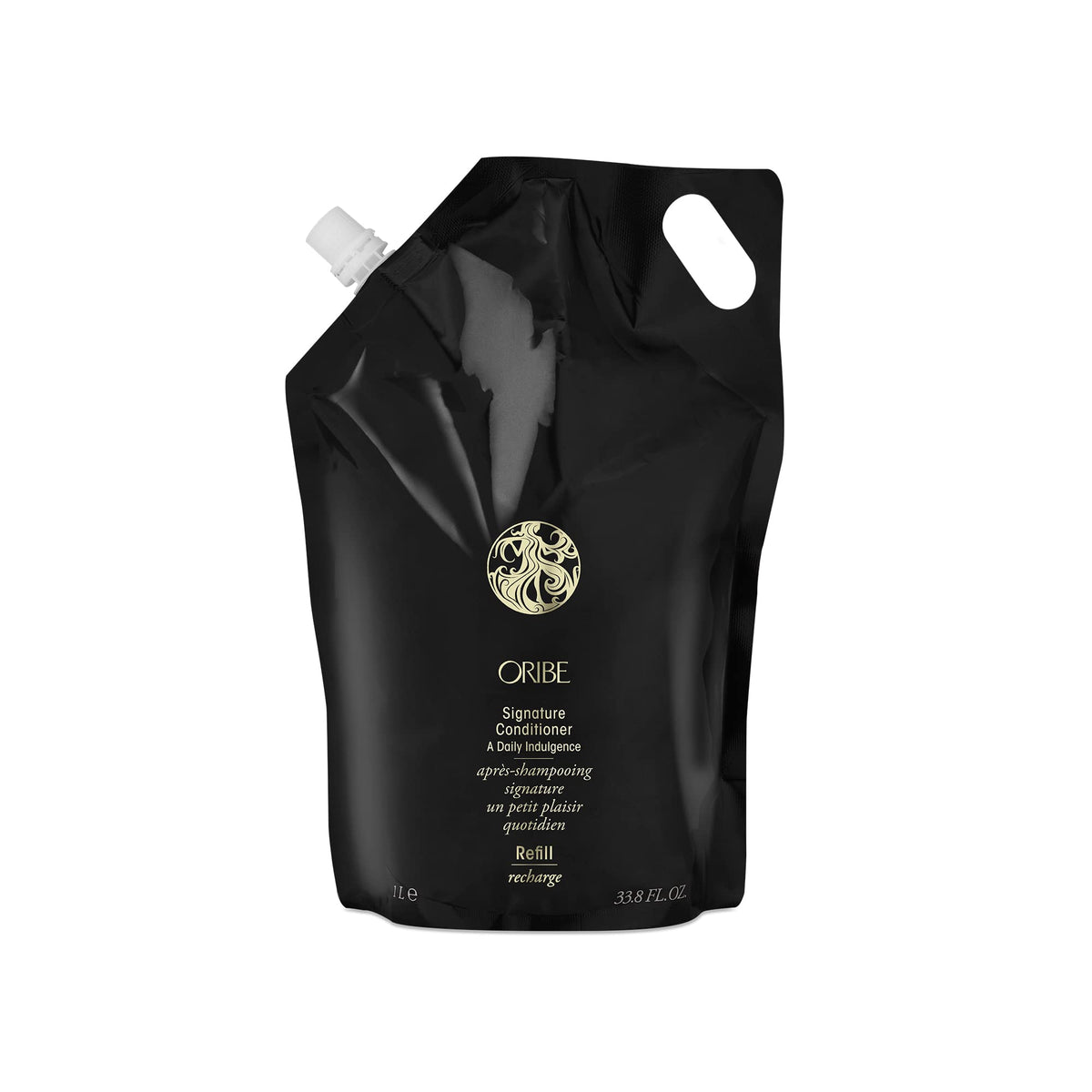 Oribe Signature Conditioner bottle pour for easy detangling and moisture boost.