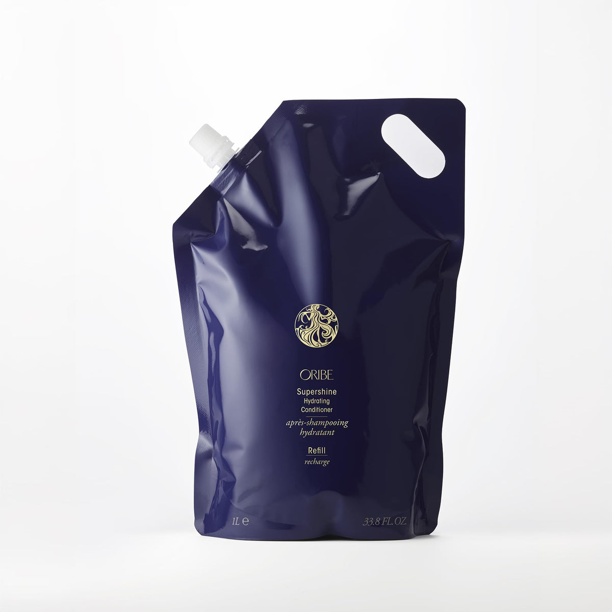 Oribe Supershine bottle pour shows rich conditioning for hydrated strands