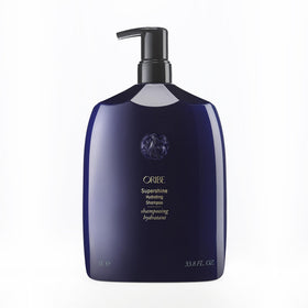 Oribe Supershine Hydrating Shampoo bottle on vanity for glossy hair