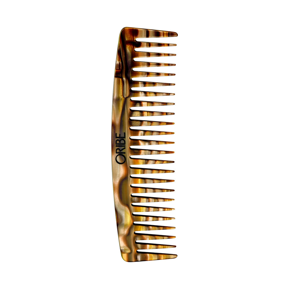 Oribe Wide Tooth Comb detangles wet hair with gentle precision.