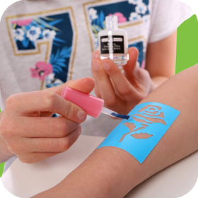 Original Stationery glitter tattoo being applied by a child at home