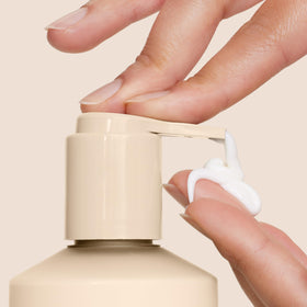Applying Origins Ginger Hand & Body Lotion for instant hydration and softness