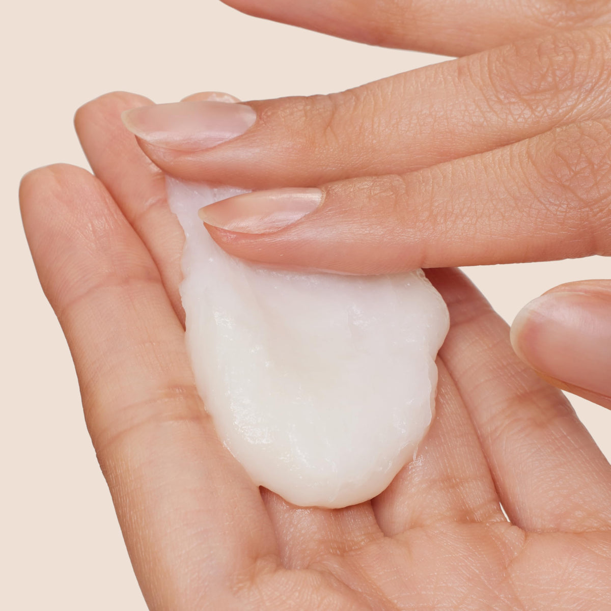 Origins Reinventing the Heel Foot Cream jar close-up emphasizing Shea Butter and Jojoba Oil.