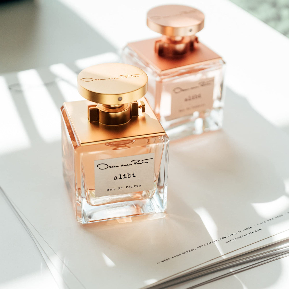 Oscar de la Renta Alibi perfume spray on skin, confident everyday use.