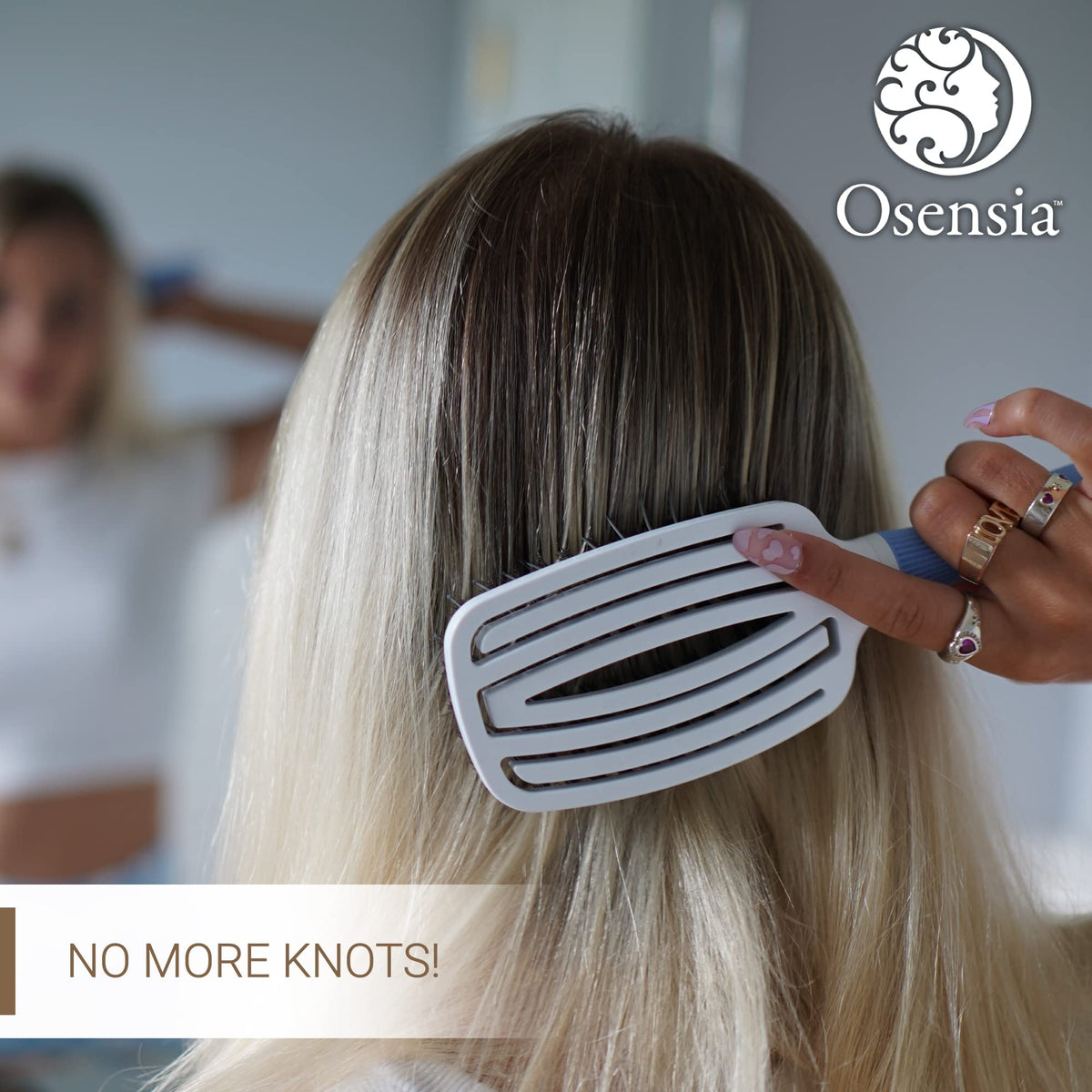 Osensia flexible head detangler brush adapts to scalp for comfortable brushing